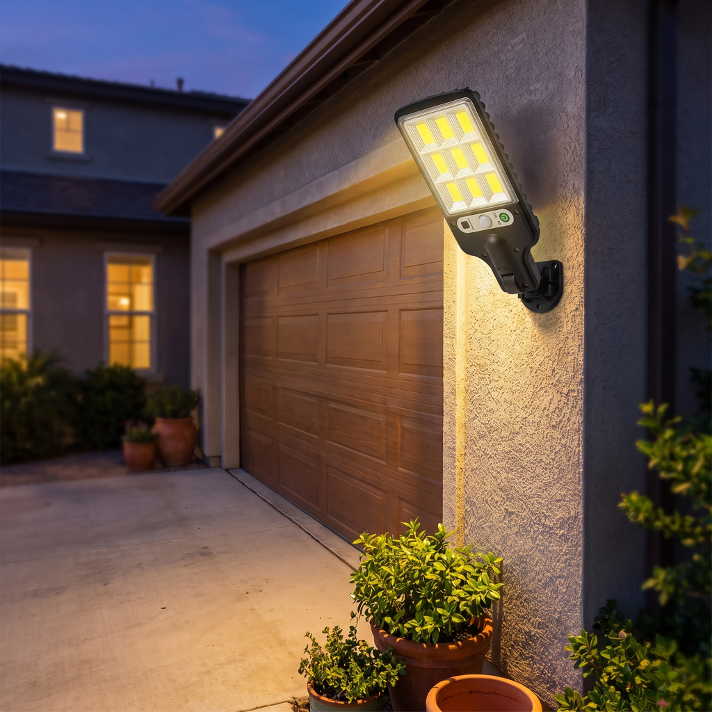 Solar LED courtyard wall lamp mounted beside a garage door at dusk